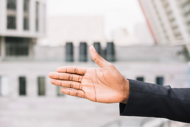 Free Photo african-american man offering hand for handshake