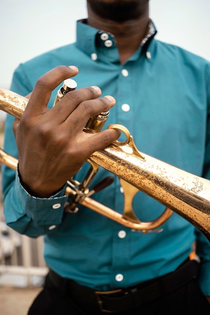 Free Photo african american man playing music on jazz day