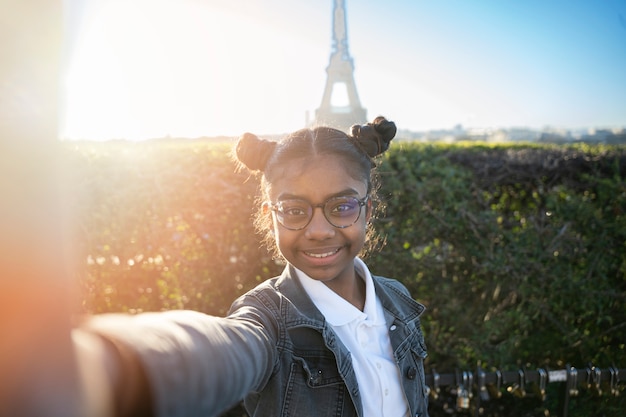 Free Photo african american man taking a picture in his travel to paris