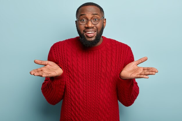 African American man wearing red sweater