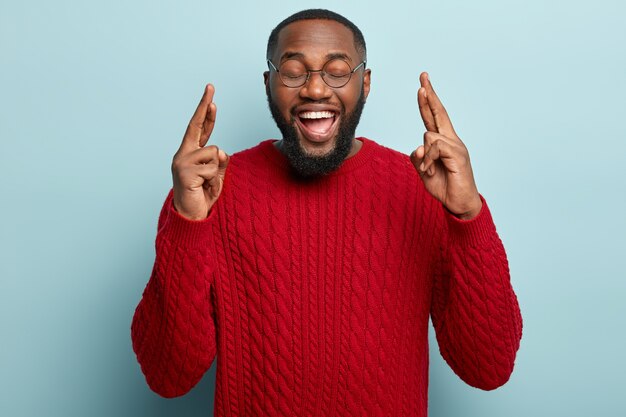 African American man wearing red sweater