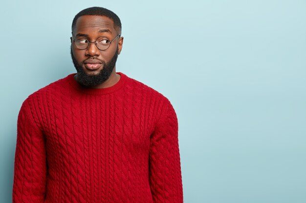 African American man wearing red sweater