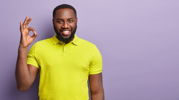 African American man wearing yellow T-shirt