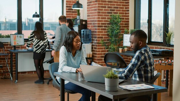 African american people greeting at job interview appointment, talking about HR recruitment and work application. Man and woman meeting to talk about executive career opportunity.