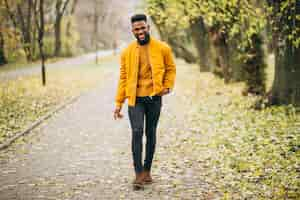 Free photo african american student walking in the park