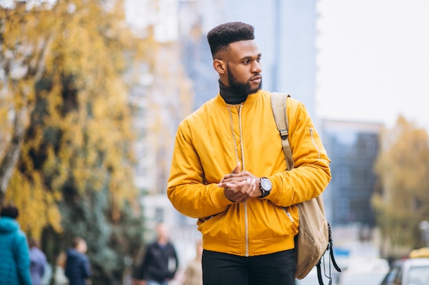 Free photo african american student walking in the street