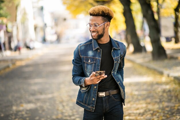 African american student with phone