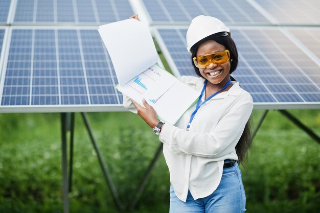 African american technician check the maintenance of the solar panels Black woman engineer at solar station