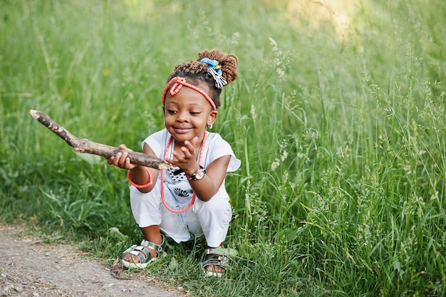 African baby girl walking at park