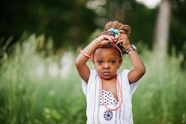 Free photo african baby girl walking at park