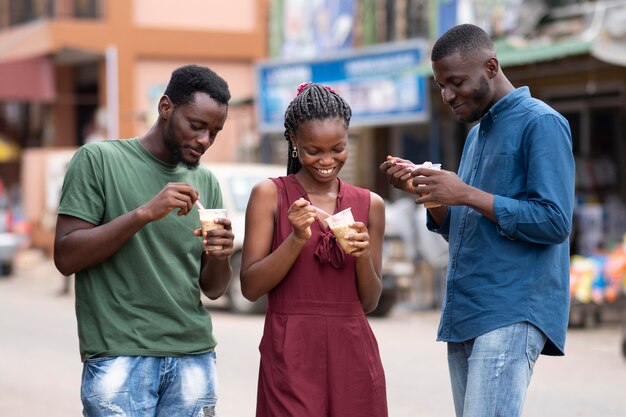 African people eating a cold beverage