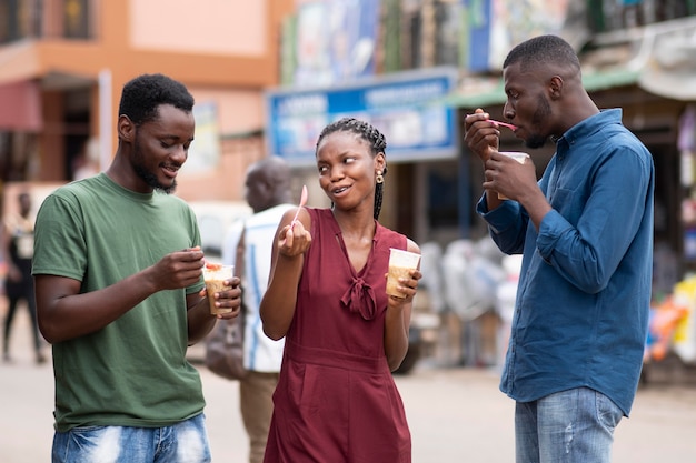 African people eating a cold beverage