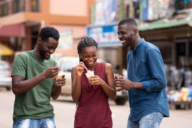 African people eating a cold beverage