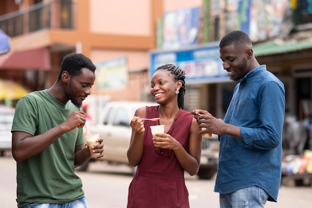 African people eating a cold beverage