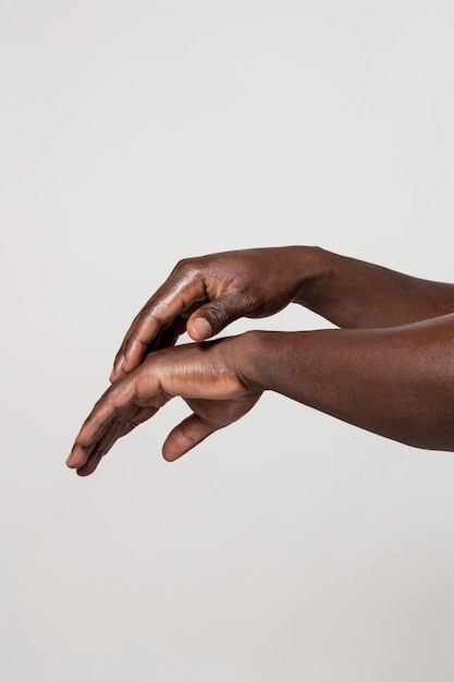 African person washing hands with soap isolated on white