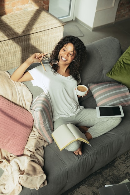 Free photo africanamerican woman freelancer during the work in home office while quarantine