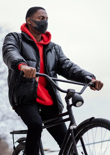 Afro-american man riding his bicycle