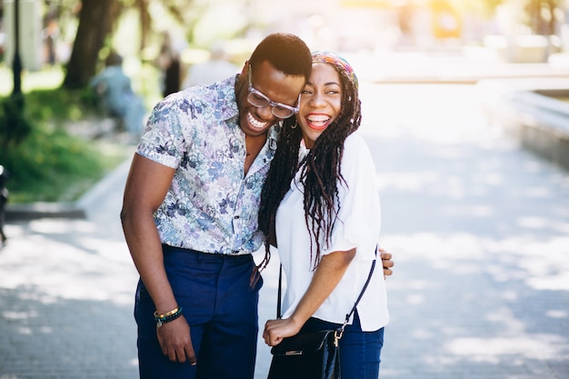 Afro american woman and man friends in the street