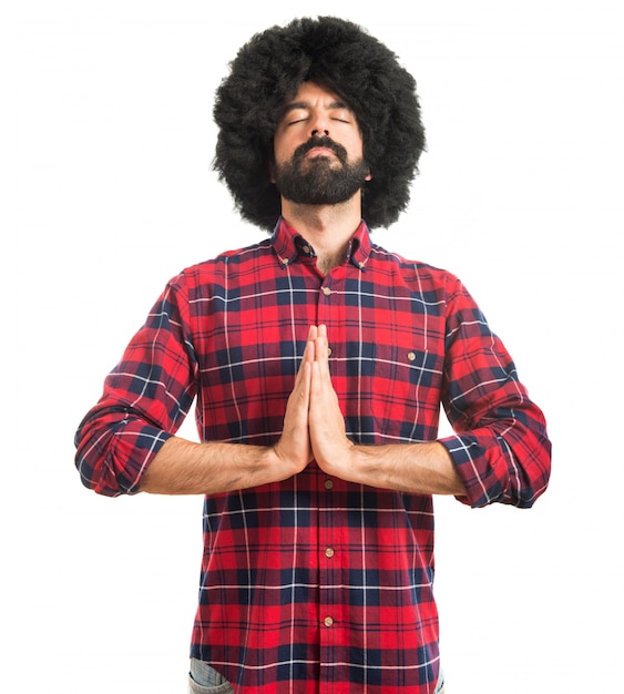 Afro man in zen position