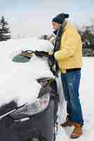 Free photo after big blizzard, car needs to clean from snow