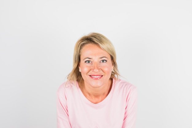 Free photo aged happy woman in rose blouse