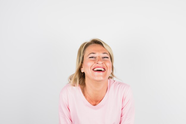 Aged laughing woman in rose blouse