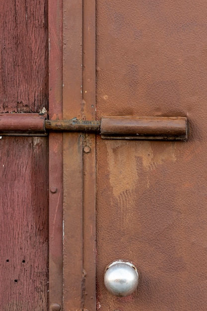 Free Photo aged metallic surface with rough wood and lock