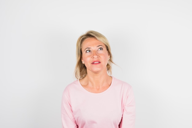 Aged woman in rose blouse