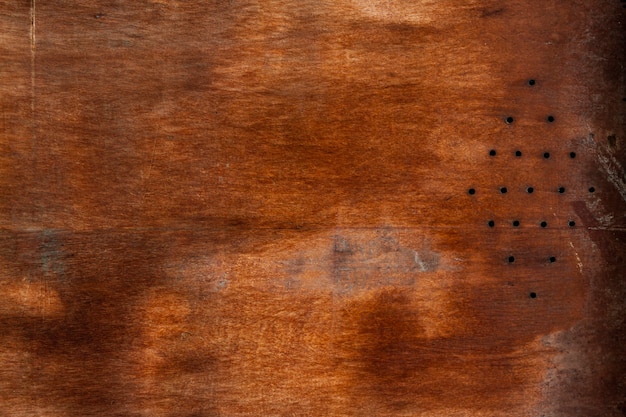 Aged wood surface with holes