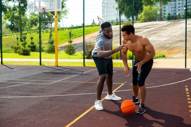 Aggressive man playing  basketball long shot