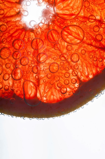 Air bubbles cover red fiber of grapefruit