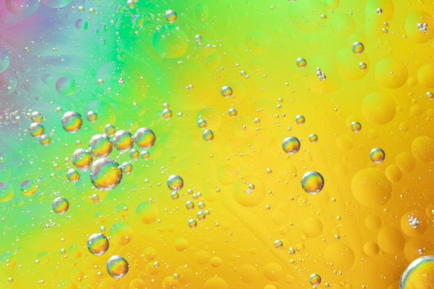 Air bubbles in oil stain on gradient blurred background