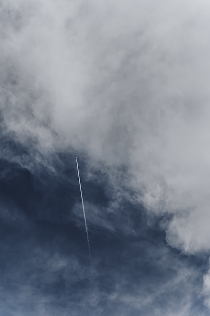 Free photo aircraft flying across the cloudy sky