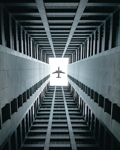 Free Photo airplane flying over the buildings.