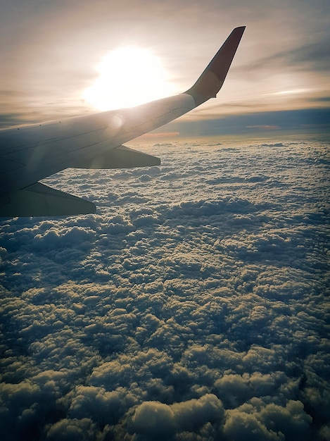 Airplane flying over the clouds