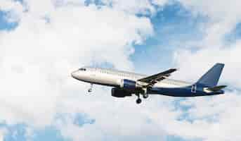 Free photo airplane flying in a cloudy sky