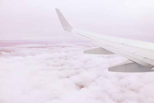 Free Photo airplane wing above the clouds