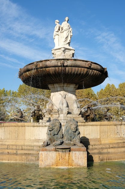 Aix-en-Provence, France - October 18, 2017 : the famous fountain Rotonde at the base of the Cours Mirabeau market street