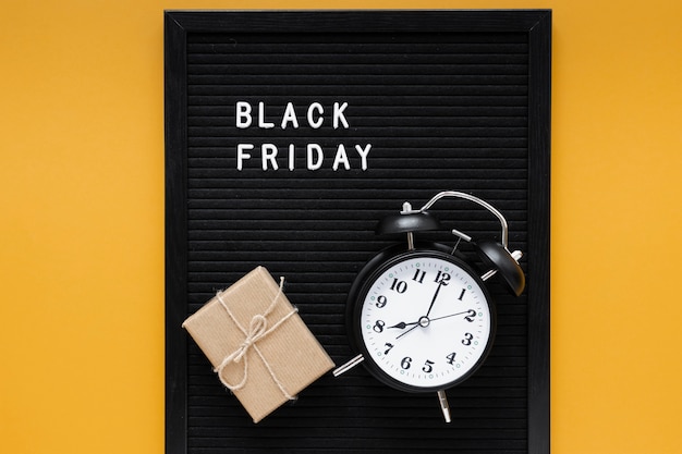 Free photo alarm clock on black friday frame