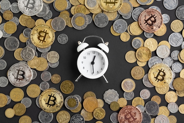 Alarm clock surrounded by currency