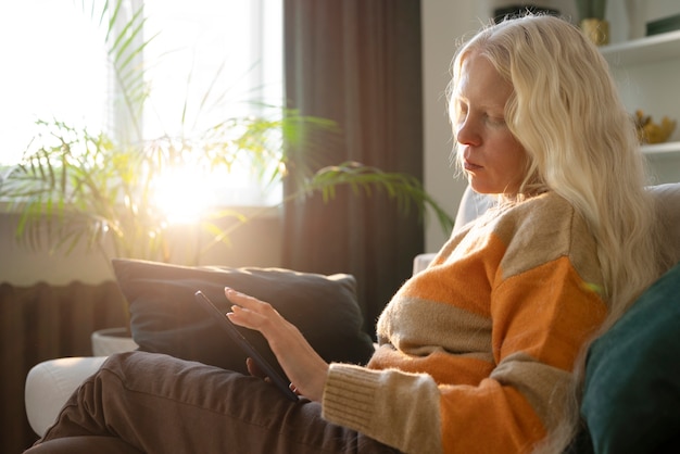 Free photo albino person doing home activities