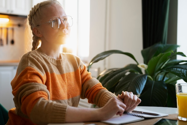 Free Photo albino person at home doing activities