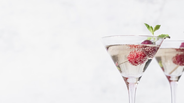 Free photo alcoholic beverage cocktail with raspberry copy space