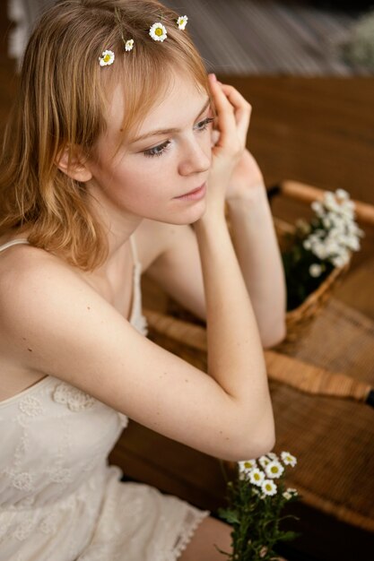 Alluring woman wearing a spring flowers crown