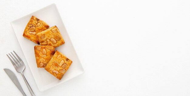 Almond biscuits and cutlery copy space