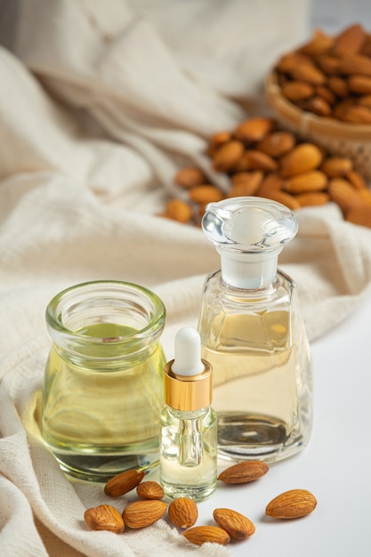 Almond oil in bottle on white background