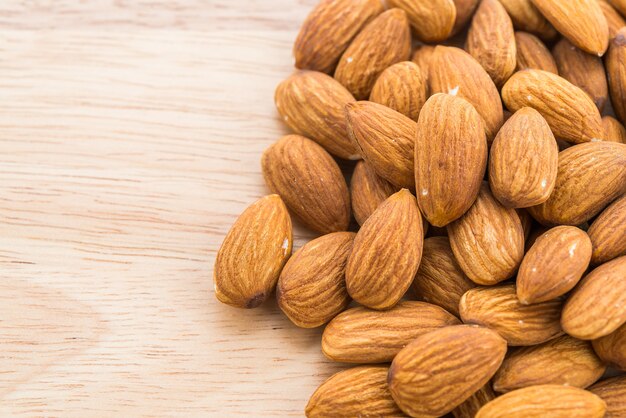 Almond on wooden background