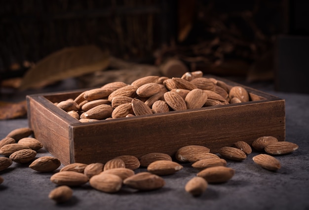 Free photo almonds in a wooden box