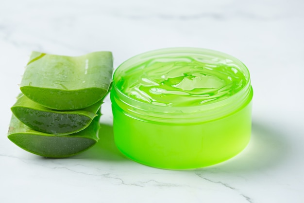 Aloe vera cosmetic cream on white surface