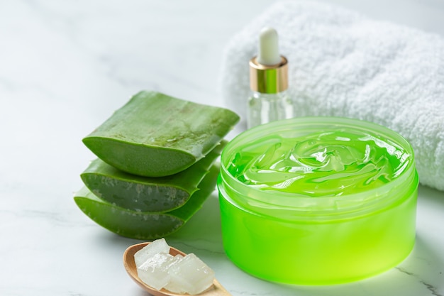 Aloe vera cosmetic cream on white surface